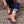 Chuffed Skates peach pink roller skates on brick floor
